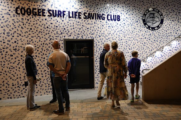 Community members gather at the Coogee Surf Life Saving Club on Monday.