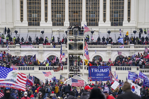 Insurrectionists loyal to President Donald Trump breach the Capitol in Washington on January 6, 2021.