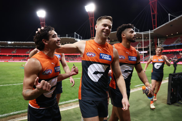 Toby Bedford and Harry Himmelberg celebrate the Giants’ win over Fremantle.