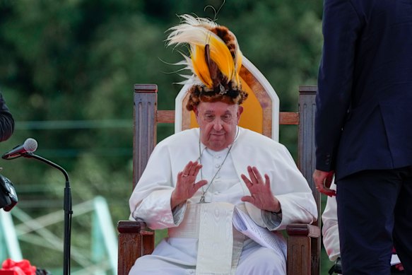 Pope Francis in a traditional hat during a meeting with faithful in Vanimo, Papua New Guinea, in September 2024.