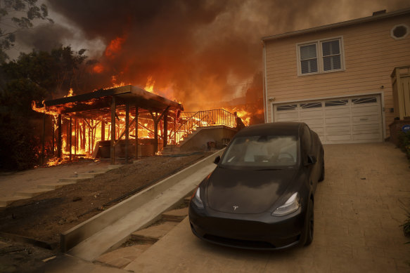 A home on fire in the Pacific Palisades neighbourhood of Los Angeles.