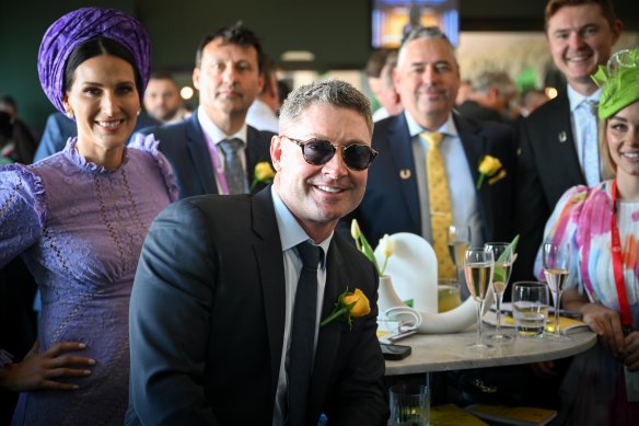 Former Australian cricket captain Michael Clarke with fellow racegoers in the Tabcorp marquee.