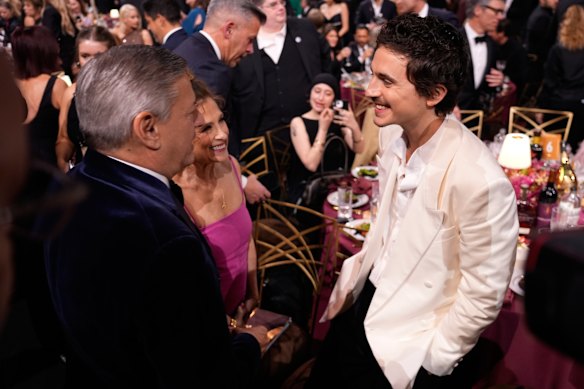 Timothée Chalamet with (left) Netflix boss Ted Sarandos and (centre) his mother, former ballet dancer Nicole Flender.