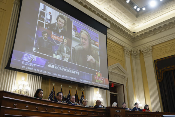 Steve Bannon displayed on screen in a clip from his radio show during evidence presented at a hearing of January 6 committee.