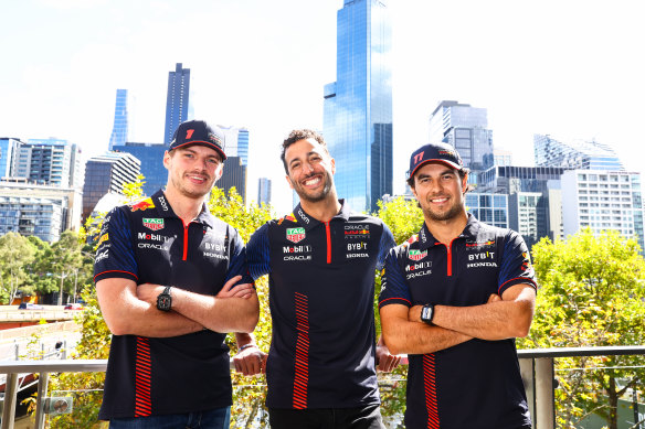 Red Bull drivers Max Verstappen and Sergio Perez stand either side of their reserve driver, Australian Daniel Ricciardo ahead of the grand prix in Melbourne.