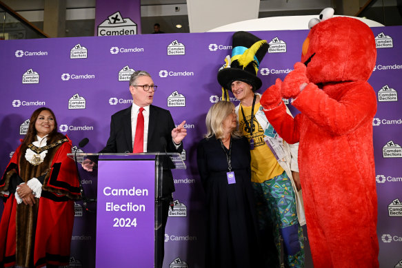 Labour leader Keir Starmer pays tribute to Nick the Incredible Flying Brick of the Monster Raving Loony Party (wearing the hat) and Bobby “Elmo” Smith (in the red costume).