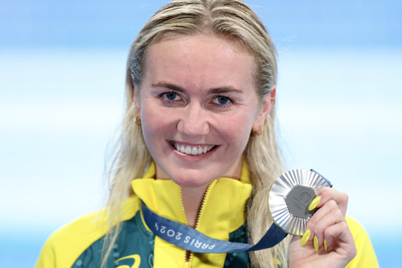 Silver medal. Gold nails. 