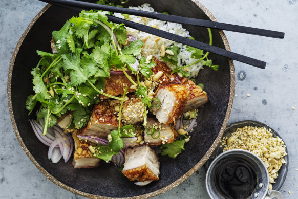 Crispy pork belly with coriander, peanut and red onion salad.