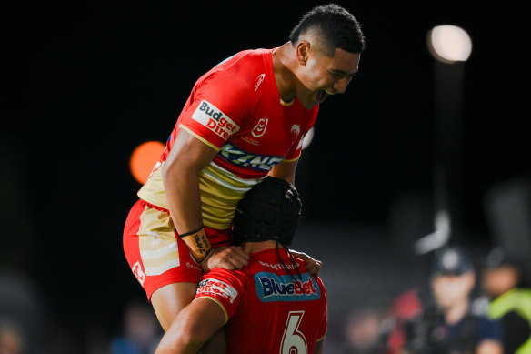 Isaiya Katoa and Kodi Nikorima celebrate for the Dolphins.