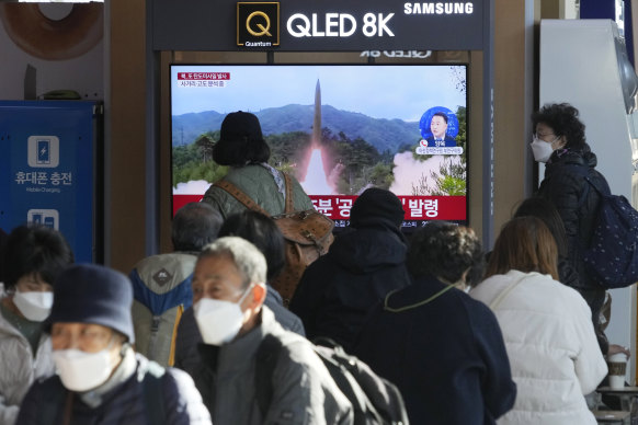A TV screen shows a file image of North Korea’s missile launch during a news program at the Seoul Railway Station in Seoul.