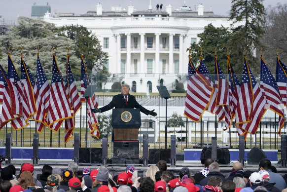 The White House in the background, then president Donald Trump speaks at a rally before a mob invaded the US Capitol on January 6, 202