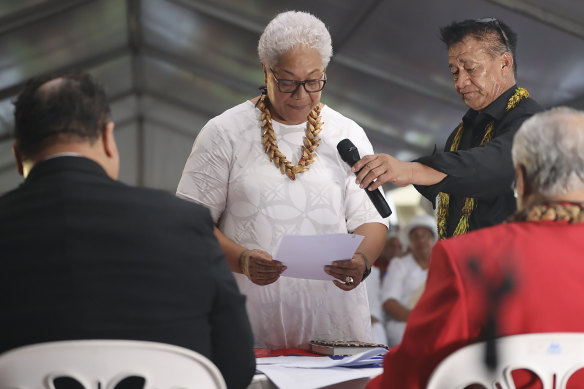 Samoa’s Prime Minister-elect Fiame Naomi Mata’afa takes her oath at an unofficial ceremony outside parliament in Apia on Monday.