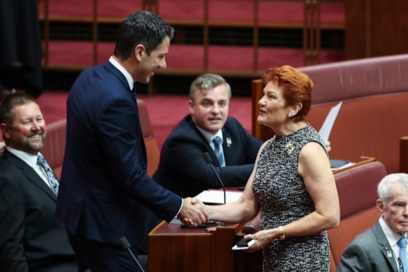 Liberal senator Alex Antic shaking hands with Hanson earlier this year.