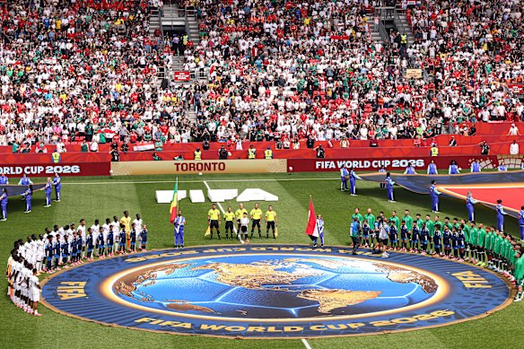 Iraq and Senegal line-up for anthems in Toronto.
