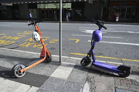 Neuron e-scooters (left) will return to Brisbane from December 3, months after Beam (right) had its contract cancelled by Brisbane City Council. 