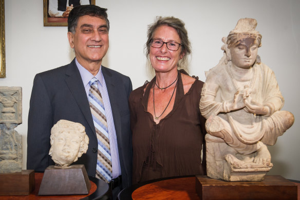 Romy Dingle hands back the Buddha to Pakistan's High Commissioner, Babar Amin.