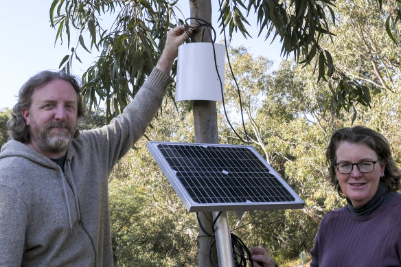 Dr Melissa Neave and Scott Rayburn with one of their 'sap sensors' on a tree at CERES Environment Park. 