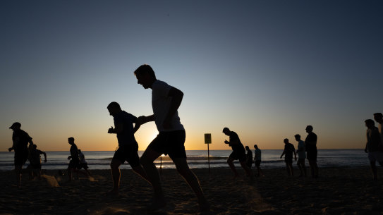 Men from the When No-One’s Watching group on Maroubra Beach.