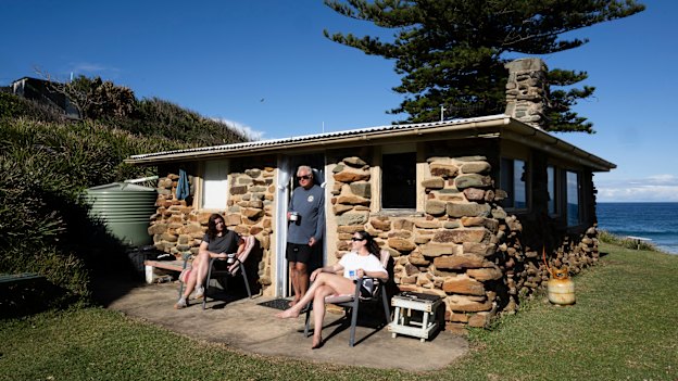 Ken Holloway with his daughters Georgia and Sophie at their shack at Era.