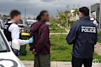One of four people arrested in Victoria over alleged contract shootings in Sydney.