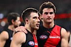 Zach Merrett of the Bombers looks dejected.