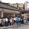 Customers queue outside a popular restaurant in Seoul, South Korea.