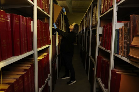 Photo special Harry Hollinsworth in the Fairfax Archives warehouse.