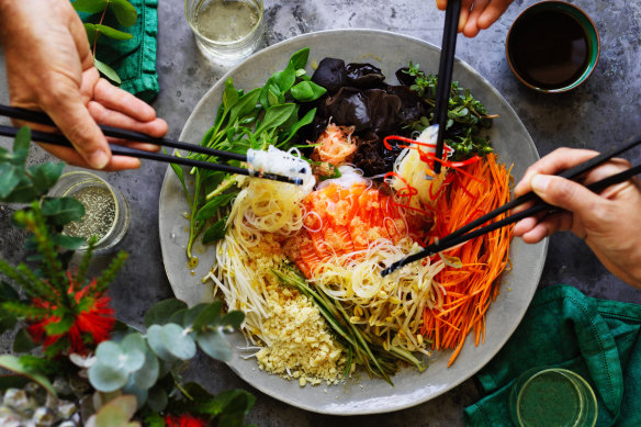 Yee sang is the recent tradition of tossing a salad high in the air for good luck. 