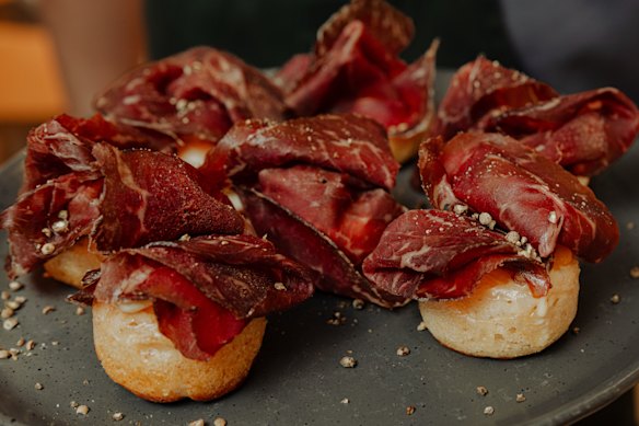 Jen Kwok Lee’s party-ready crumpets topped with wagyu bresaola, egg yolk jam and creme fraiche.