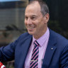 Jeff Pope serves The Age democracy sausages at AEC hq in Melbourne.