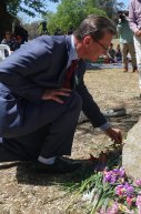 ACT Attorney General Gordon Ramsay laying flowers for drug victims.