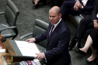 Treasurer Josh Frydenberg delivering last year's budget which forecast a surplus of $7.1 billion and a lid on spending. Now facing a deficit of more than $200 billion, the treasurer is being urged to lift spending.