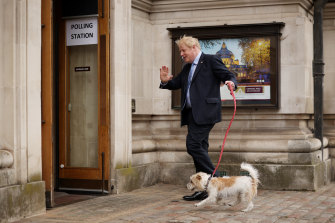 British Prime Minister and Conservative Party leader Boris Johnson arrives to cast his vote at a polling station in London.