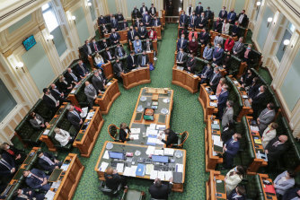 Queensland MPs standing to indicate their vote in favour of the Palaszczuk government’s voluntary assisted dying bill at the end of its second reading debate on Thursday, 16 September, 2021.