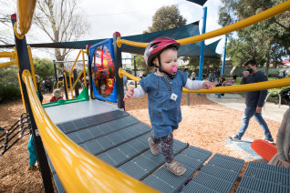 20-month-old Florence Kozel enjoys the reopening of Fels park in Yarraville.