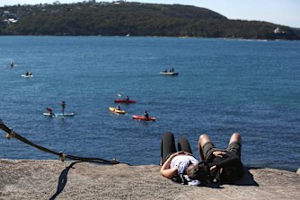 People enjoying the weather at Balmoral beach on Sunday. 