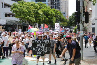 Protesters, broadly opposed to Queensland’s incoming vaccine mandate, in Brisbane’s CBD on November 17.
