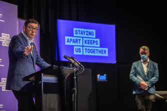 Mr Andrews alongside new Health Minister Martin Foley on Sunday.