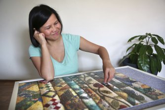 Liz Ho hard at work on her latest puzzle.