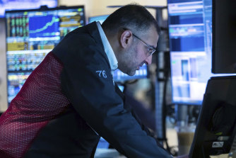 Trader Aman Patel work on the New York Stock Exchange’s trading floor.