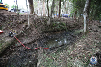 Police pump the creek on the fifth day of the search