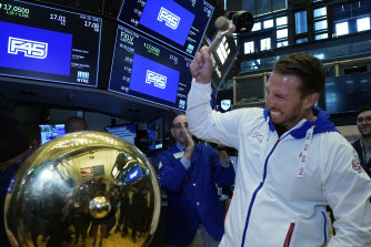 F45 Training Holdings former CEO & co-founder Australian Adam Gilchrist rings a ceremonial bell on the New York Stock Exchange trading floor as his company’s IPO begins trading.