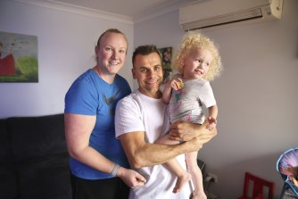 Anthony Matthews with partner Natalie and two-year-old daughter Kayla at their Glendenning home in western Sydney.