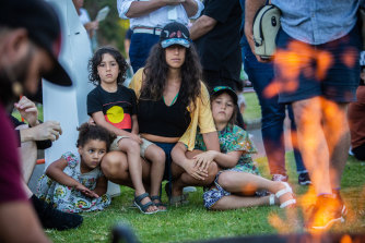 Parents and children gathered at the St Kilda ceremony, some wearing the newly-freed Aboriginal flag.