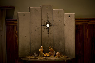 A new artwork dubbed "Scar of Bethlehem" by the artist Banksy is displayed in The Walled Off Hotel, in the West Bank city of Bethlehem.