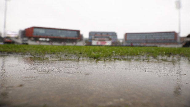 Rain saved Australia from a heavy defeat at Old Trafford.