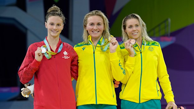 Summer McIntosh, Ariarne Titmus and Kiah Melverton receive their medals after the womens’ 400m final at the Commonwealth Games.