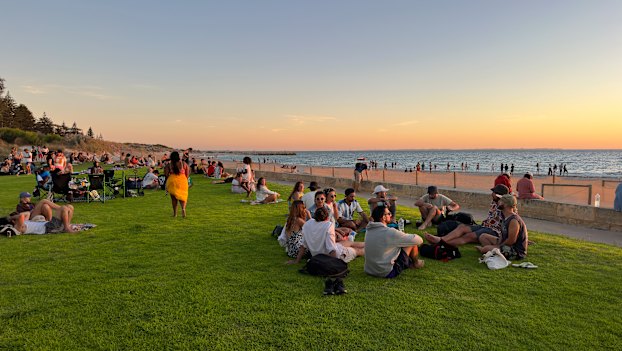 A multicultural mecca: locals and visitors gather at Wilson Park to watch the sun dipping into the Indian Ocean.