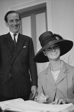 April Ashley signs the marriage register with her husband Arthur Corbett September 11, 1963. 