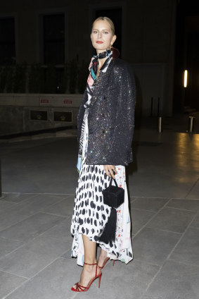 Fringe benefits ... Karolina Kurkova in Milan with one of the season's hottest trends on her arm.